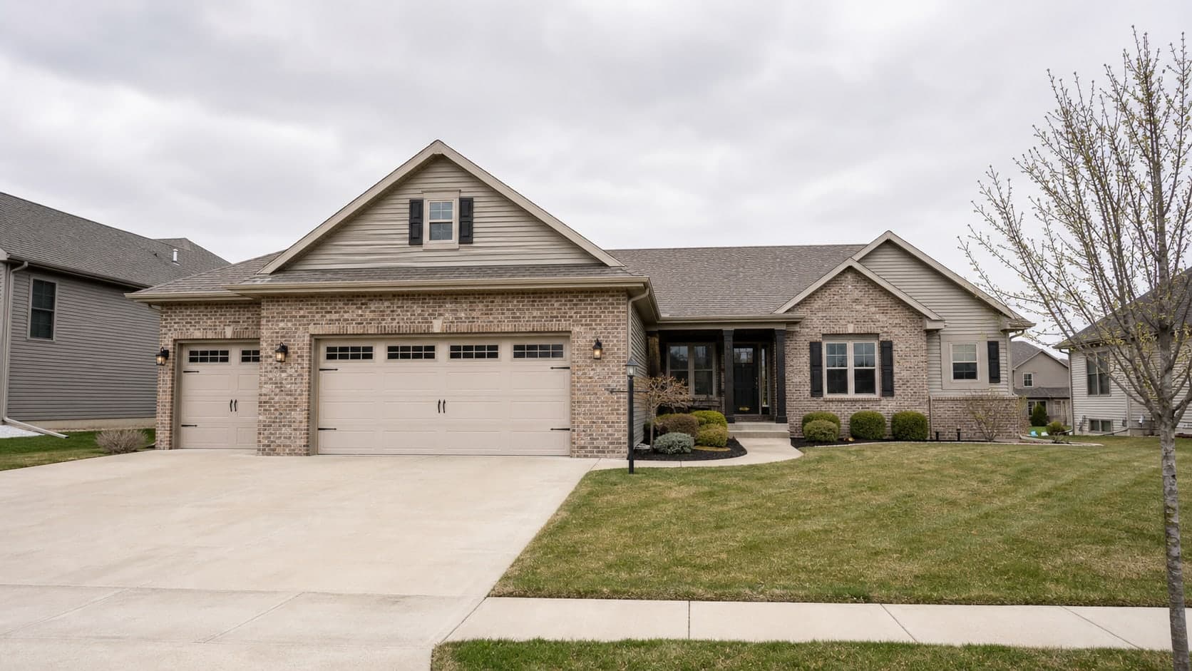 Clean suburban listing exterior photographed on an overcast day before sky replacement and lighting correction