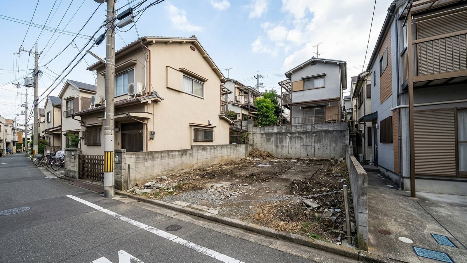 Vacant narrow Japanese urban infill lot before AI house rendering