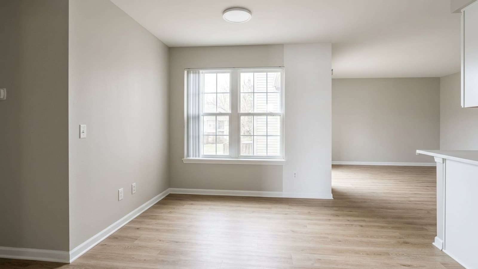 Vacant rental dining room before AI virtual staging